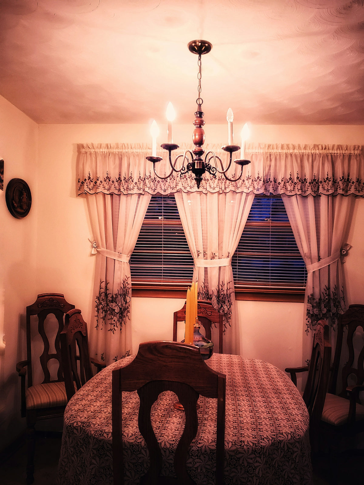 Dining table under a chandelier